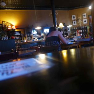 'Two Women Studying At Urban Stampede' by Zack Schuster